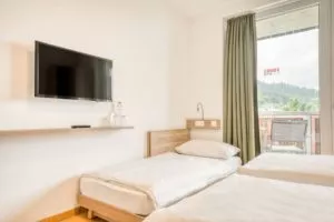 Ein Extrabett in den COOEE alpin Hotels kann man bei einer Direktbuchung kostenfrei dazubuchen.