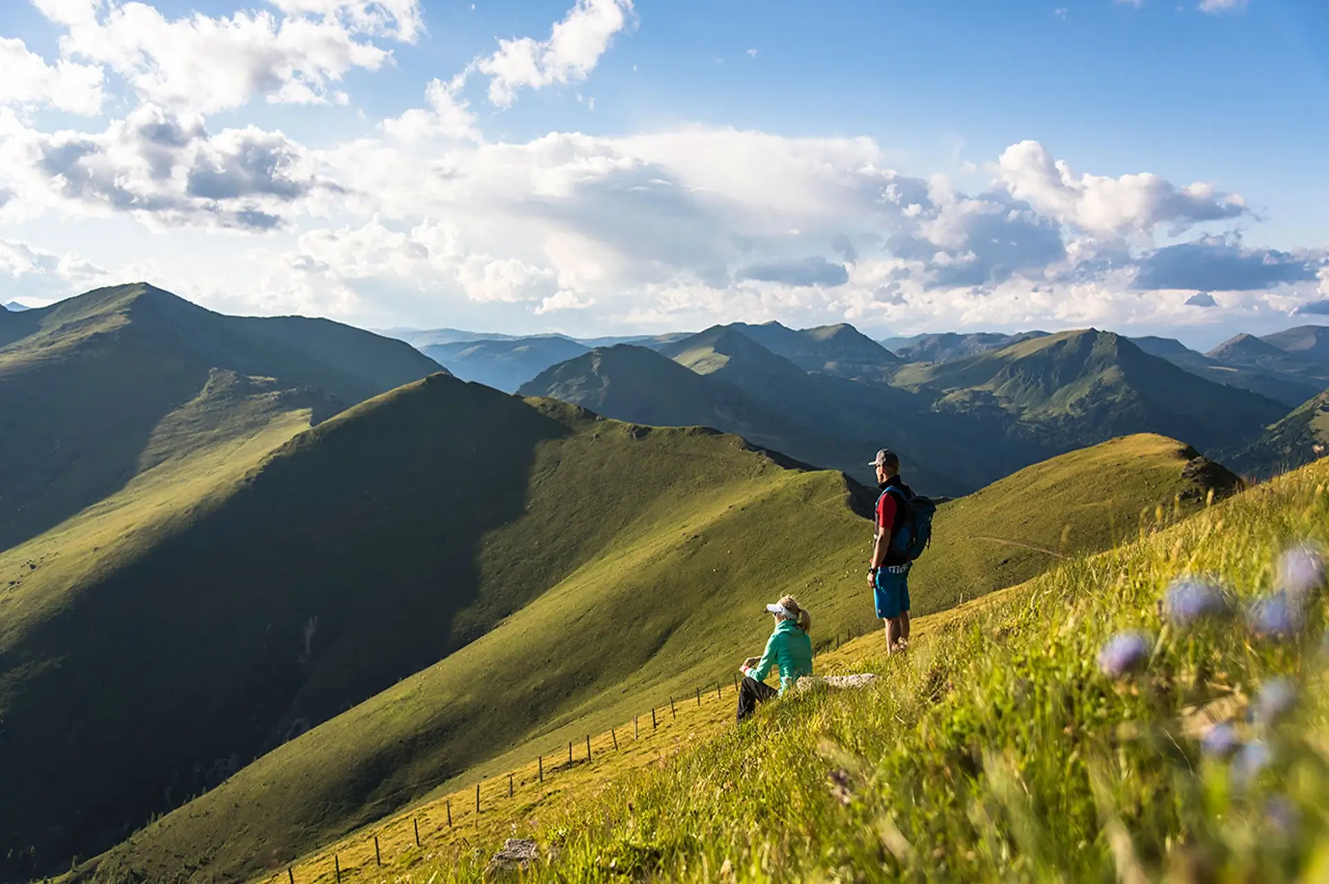 Two hikers in the middle of the Nockberge Biosphere Reserve in Carinthia.